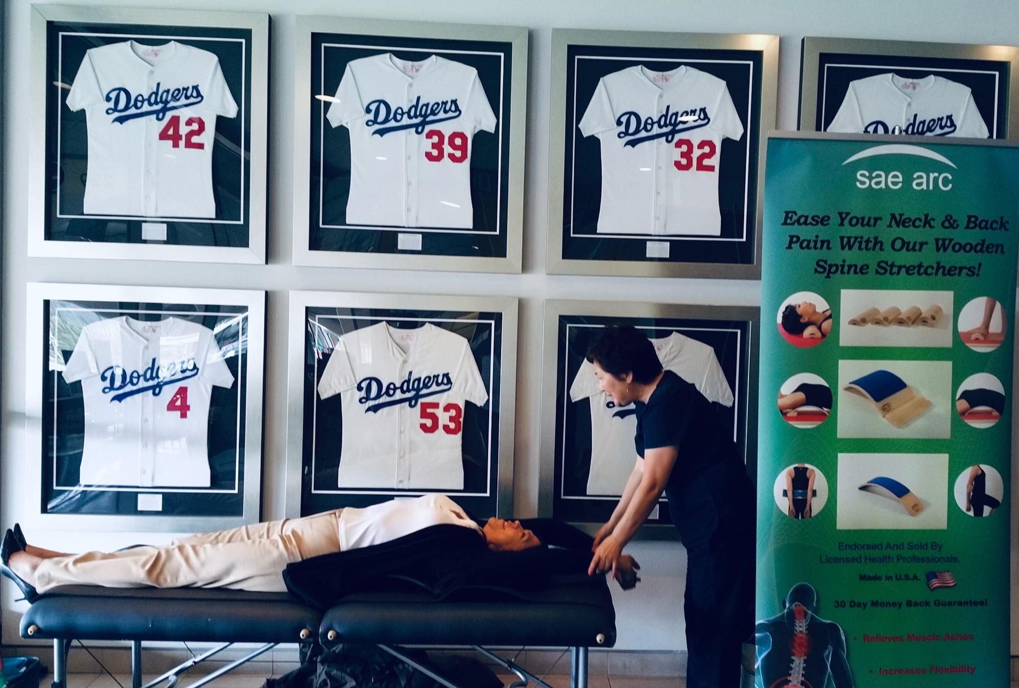 An onsite massage therapist working with an employee