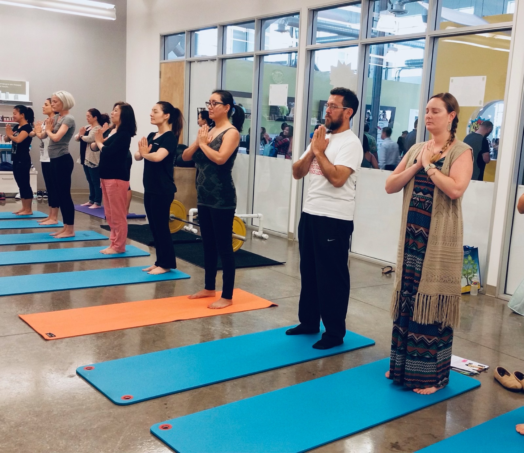 Employees taking part in an onsite yoga class